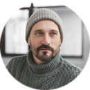 portrait picture of Paul Reed wearing a knit sweater and toque