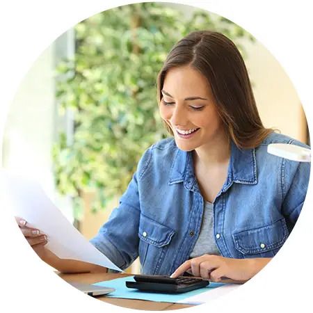 person reviewing their financial statements and making calculations