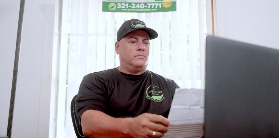 Small business owner using virtual terminal to receive payments.